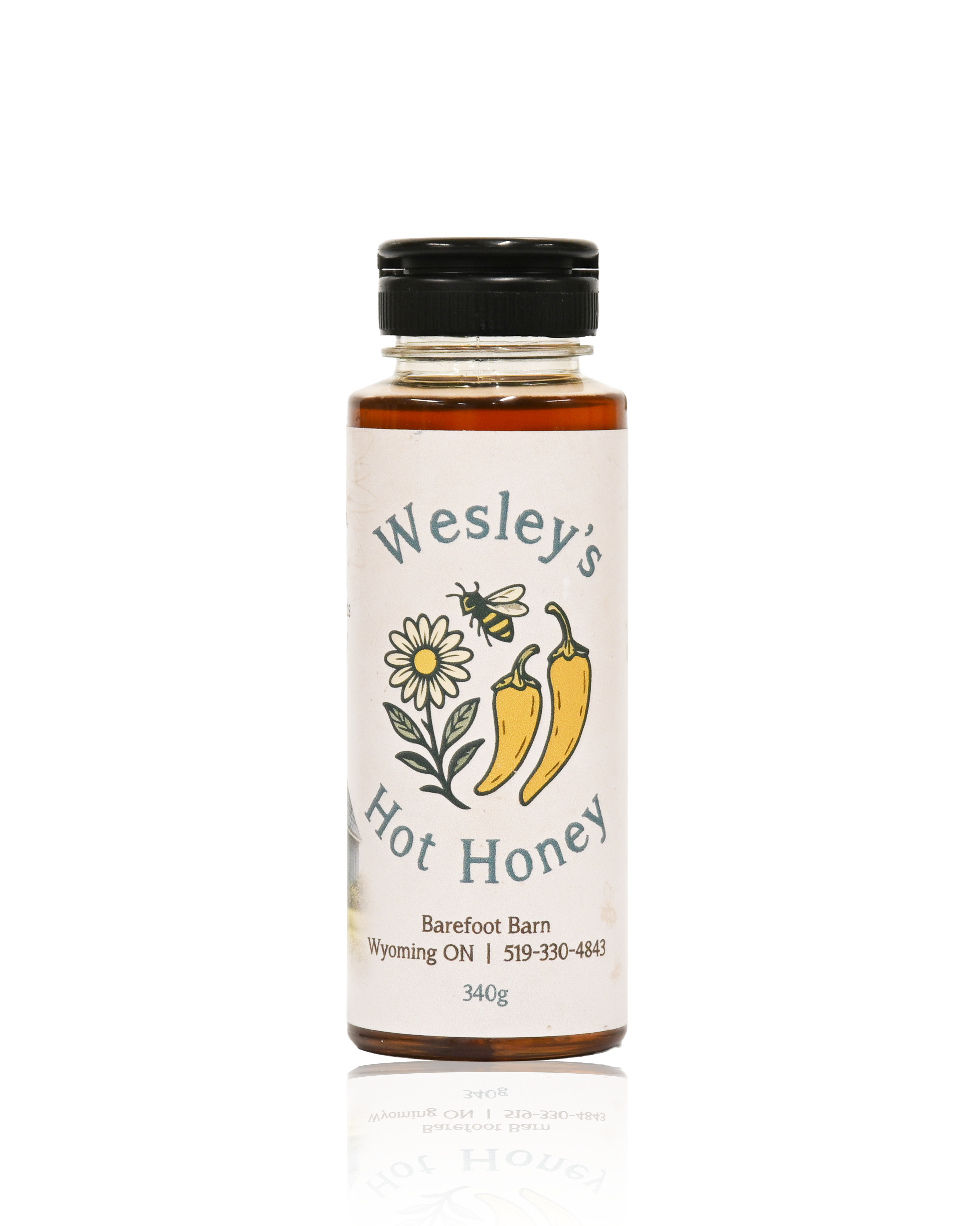 Bottle of Wesley's Hot Honey with branding and product details on a white background