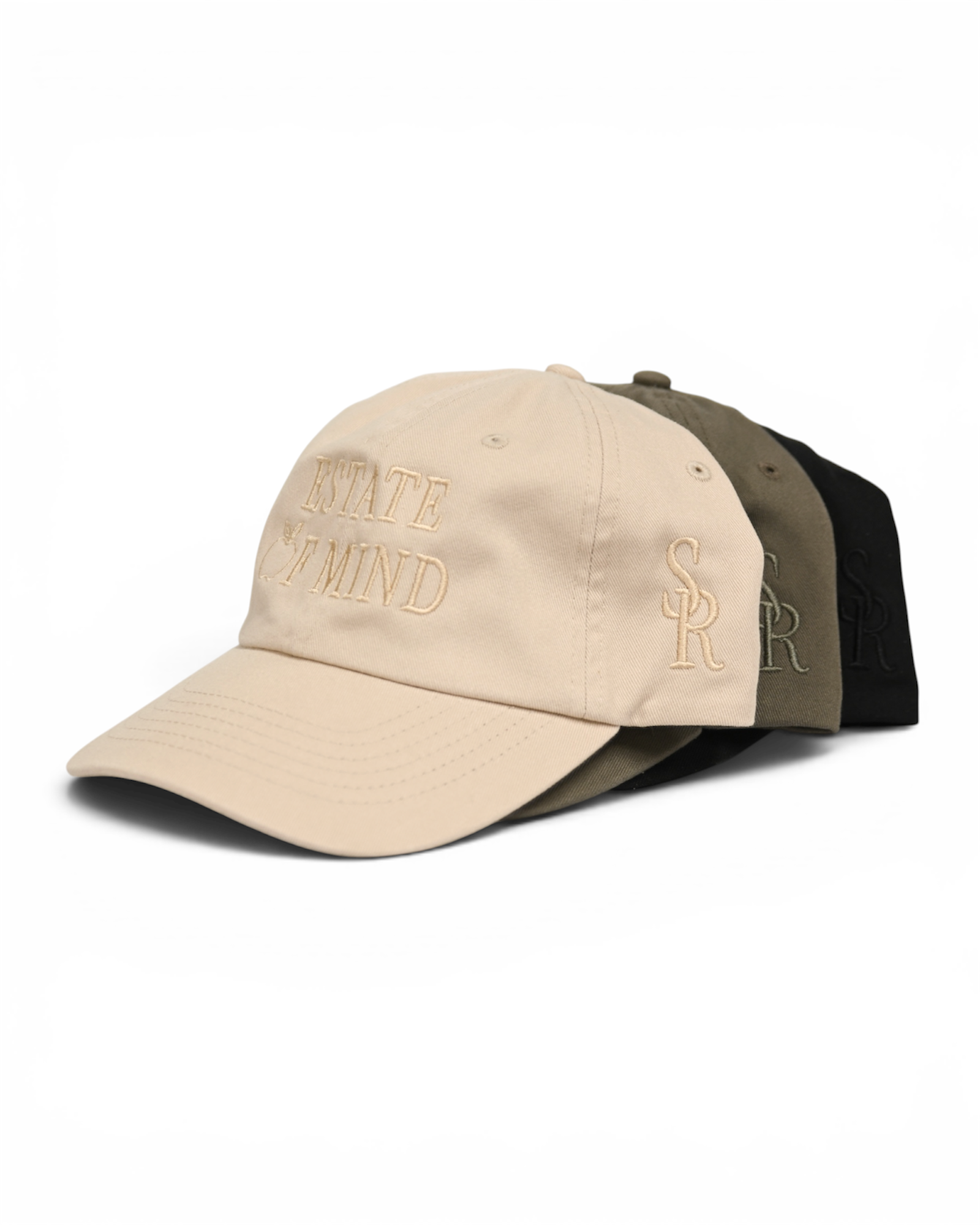 Three caps in beige, green, and black on a white background